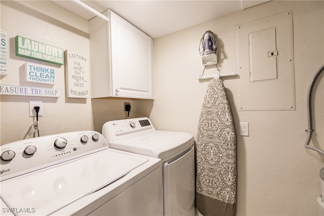 laundry area featuring electric panel, cabinets, and independent washer and dryer