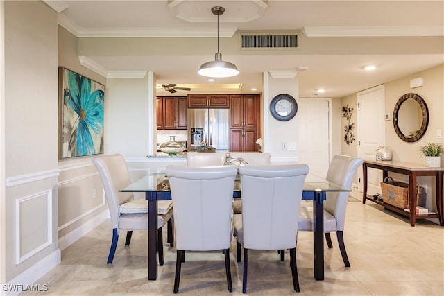 dining room with ornamental molding and light tile patterned flooring