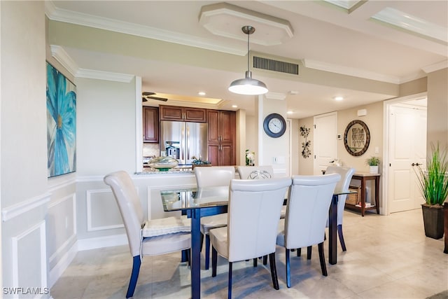 dining area with ornamental molding