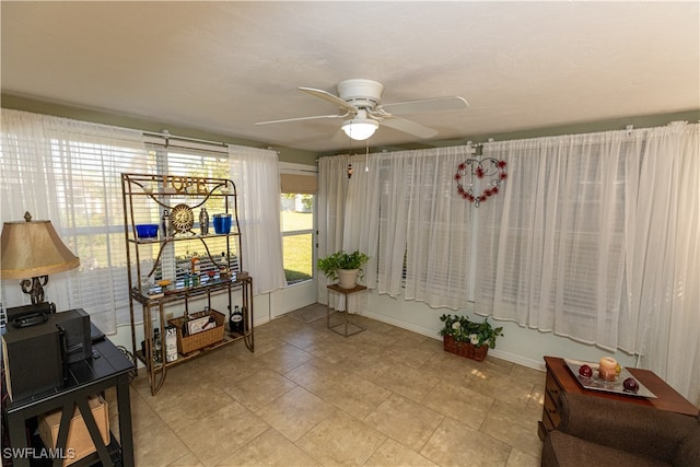 interior space featuring ceiling fan