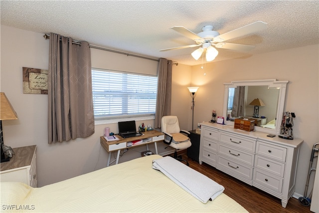 bedroom with a textured ceiling, dark hardwood / wood-style floors, and ceiling fan