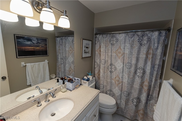 bathroom with tile patterned flooring, vanity, toilet, and an inviting chandelier