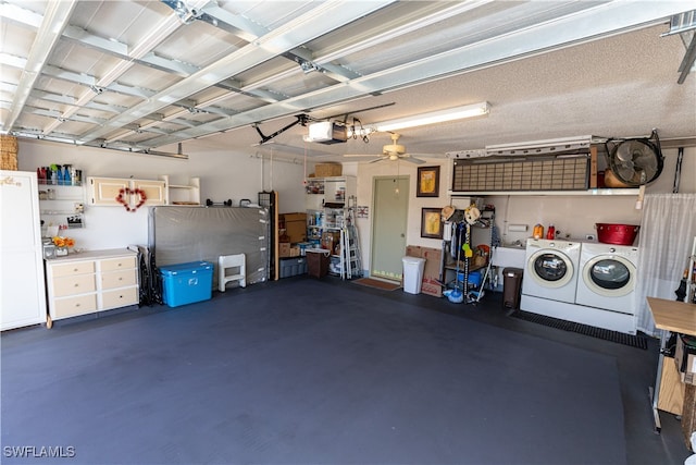 garage with separate washer and dryer, a garage door opener, and ceiling fan