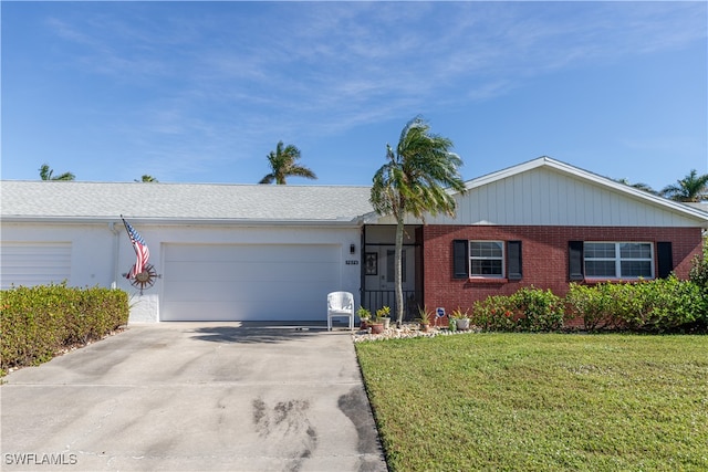 ranch-style house with a garage and a front lawn