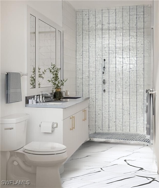 bathroom with toilet, a tile shower, and vanity