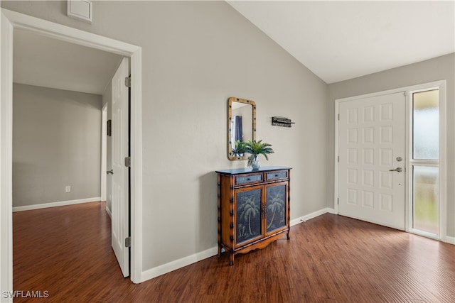 entryway featuring dark hardwood / wood-style flooring and vaulted ceiling