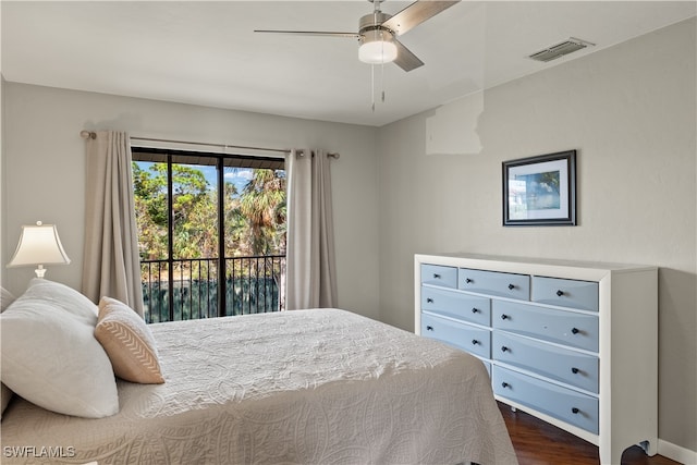 bedroom featuring access to exterior, ceiling fan, and dark wood-type flooring