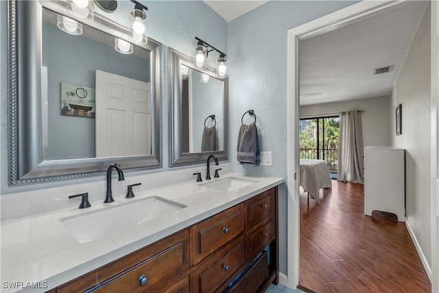 bathroom featuring vanity and hardwood / wood-style flooring