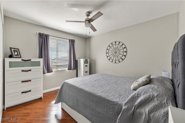 bedroom featuring dark hardwood / wood-style flooring and ceiling fan