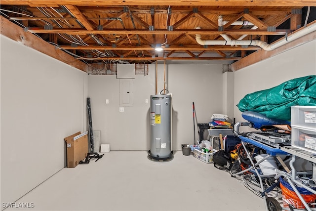 basement with electric water heater and electric panel