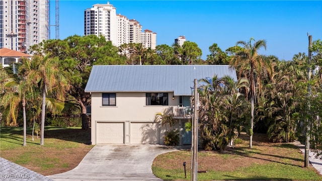 view of front facade with a garage and a front lawn