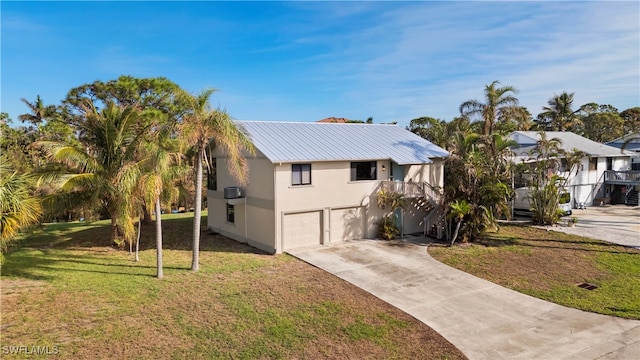 view of front facade featuring a front yard and a garage