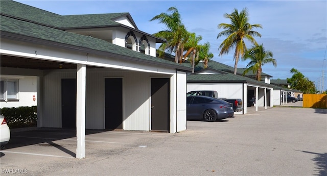 view of vehicle parking featuring a carport