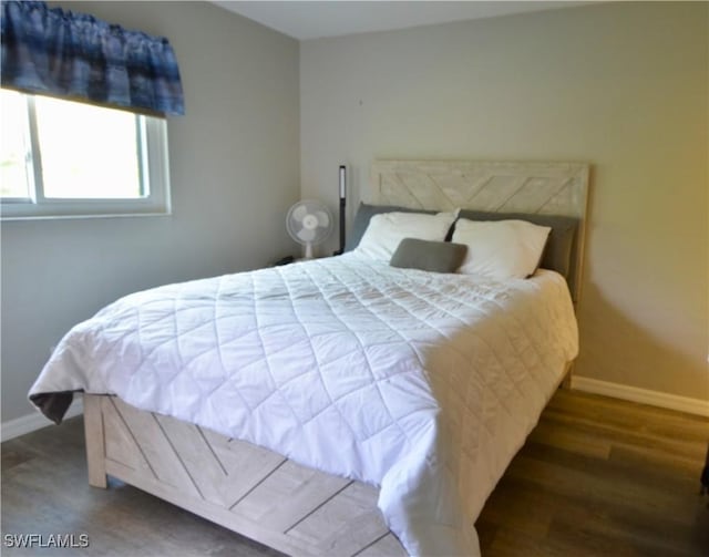 bedroom featuring dark wood-type flooring