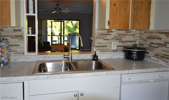 kitchen featuring dishwasher, white cabinets, sink, ceiling fan, and tasteful backsplash