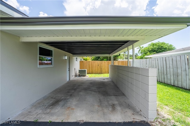 view of vehicle parking featuring a carport