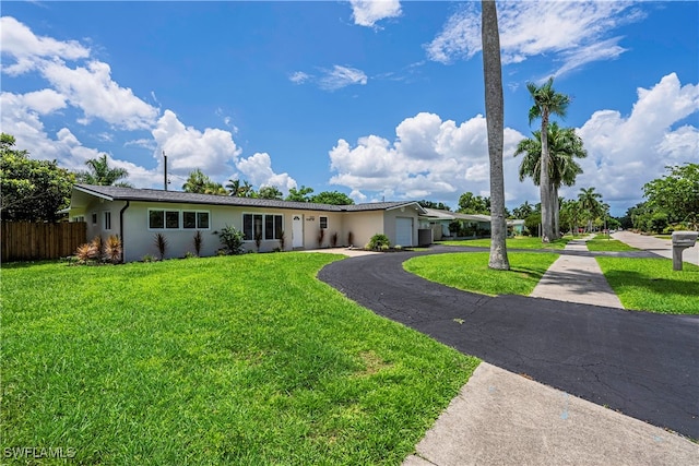 single story home with a front yard