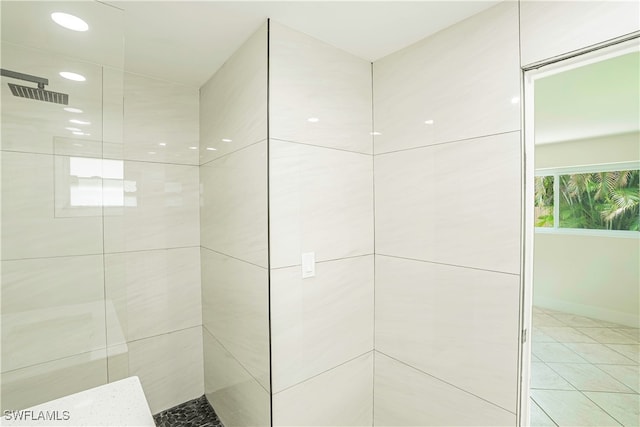 bathroom with tiled shower