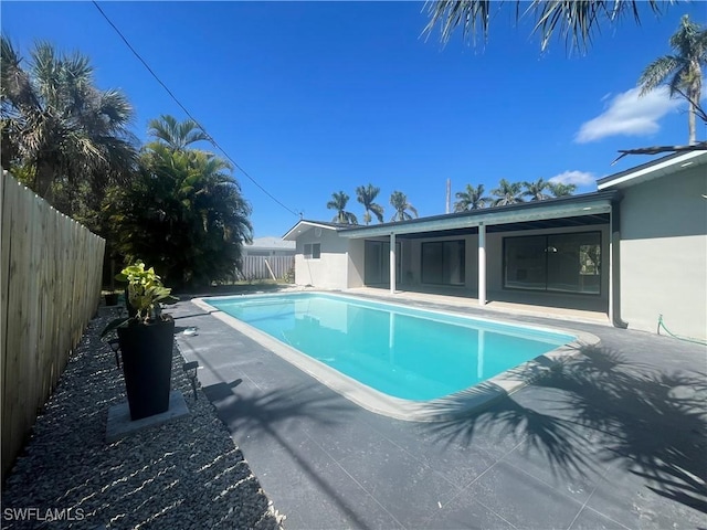 view of pool featuring a fenced backyard, a fenced in pool, and a patio