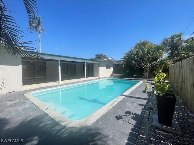 view of pool featuring a fenced in pool, a patio area, and a fenced backyard