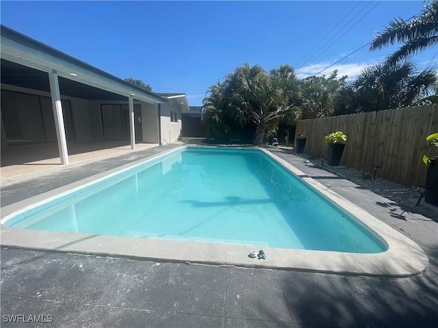 view of pool featuring a patio, a fenced backyard, and a fenced in pool