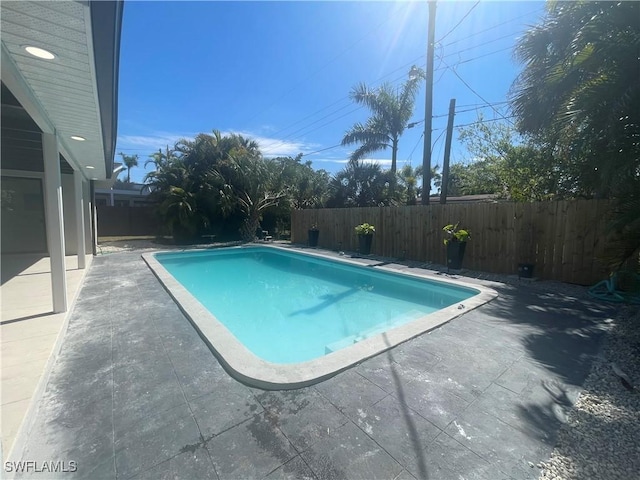 view of pool with a fenced in pool, a patio area, and a fenced backyard