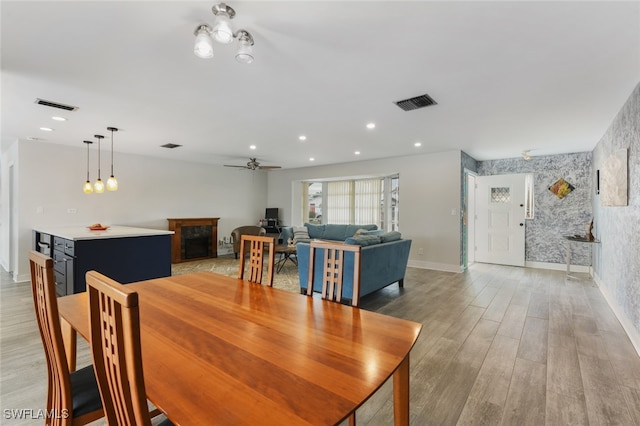 dining area featuring light hardwood / wood-style flooring and ceiling fan