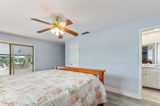 bedroom with access to outside, hardwood / wood-style flooring, ensuite bath, and ceiling fan