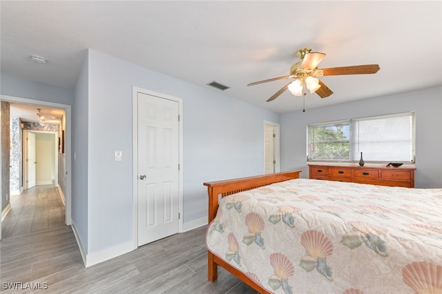 bedroom featuring ceiling fan and light hardwood / wood-style floors