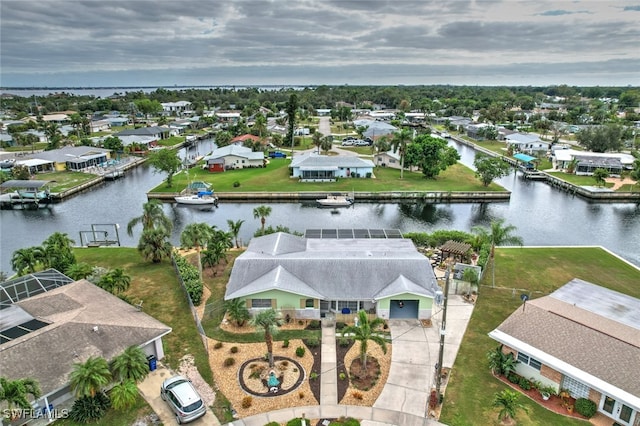 drone / aerial view with a water view