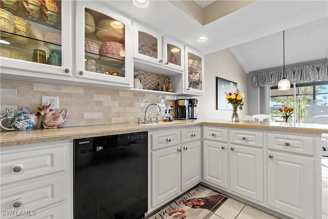 kitchen featuring white cabinets, light tile patterned floors, decorative light fixtures, dishwasher, and lofted ceiling