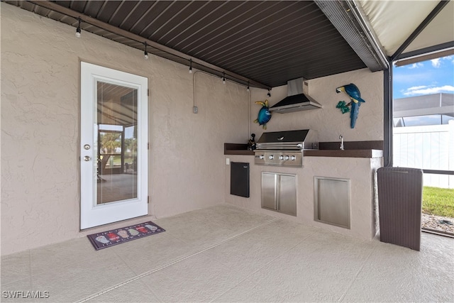 view of patio with a grill and exterior kitchen