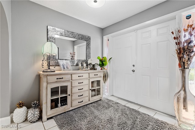 entrance foyer featuring light tile patterned floors