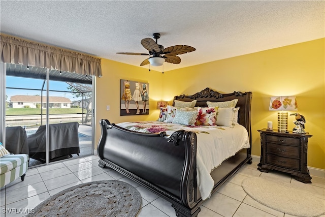 tiled bedroom with ceiling fan, a textured ceiling, and access to outside