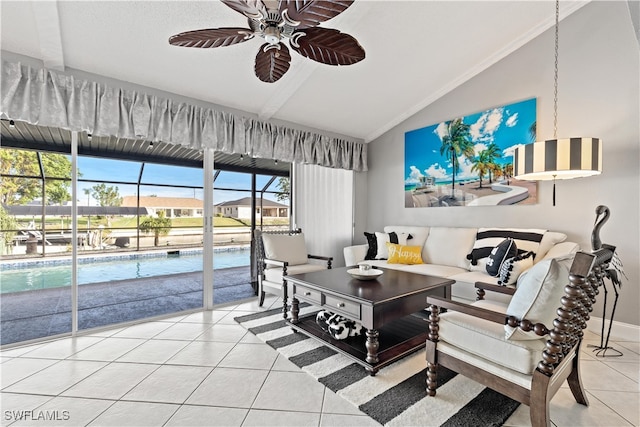 living room with tile patterned flooring, ceiling fan, and vaulted ceiling