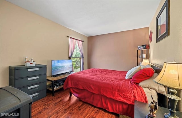 bedroom featuring dark hardwood / wood-style floors