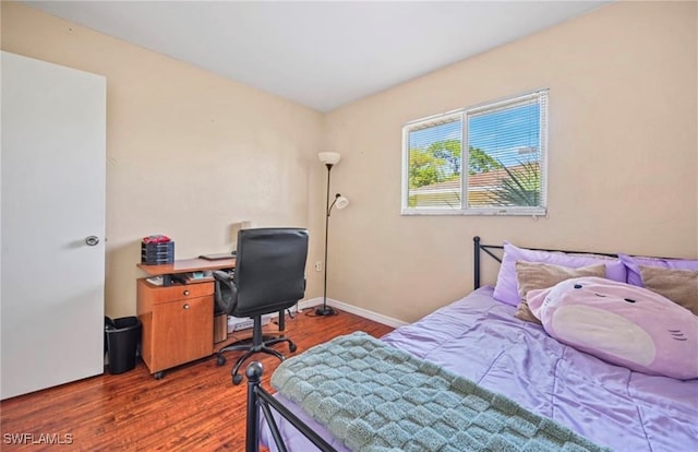 bedroom featuring dark hardwood / wood-style flooring