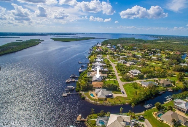 birds eye view of property with a water view