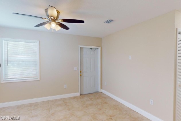 spare room with ceiling fan