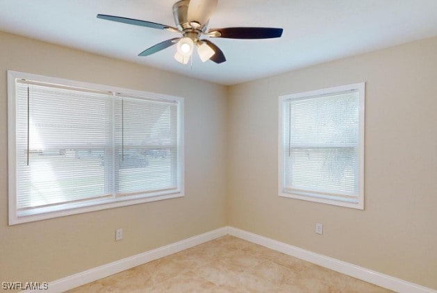 unfurnished room featuring ceiling fan