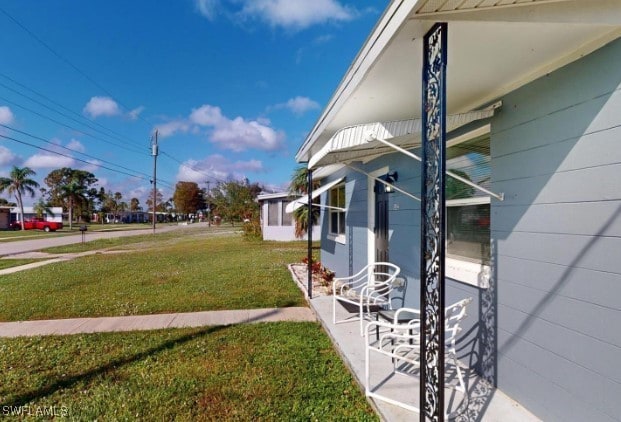 view of side of property featuring a yard