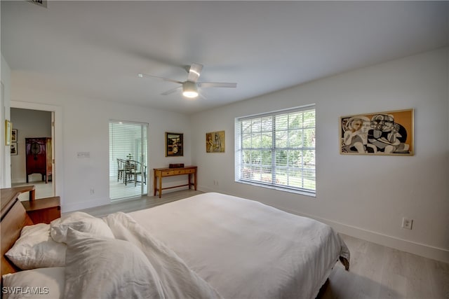 bedroom featuring light hardwood / wood-style flooring and ceiling fan