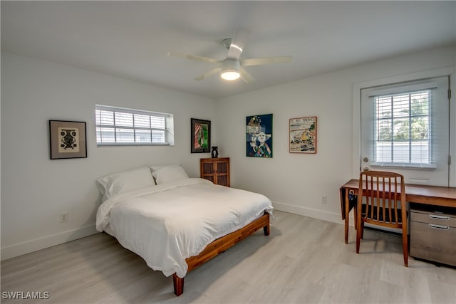 bedroom with ceiling fan and light hardwood / wood-style flooring