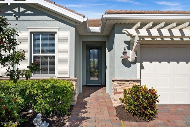 doorway to property featuring a garage