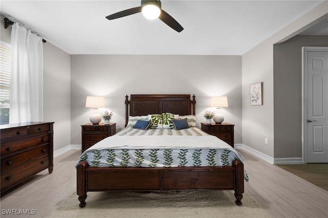 bedroom featuring ceiling fan and light hardwood / wood-style flooring