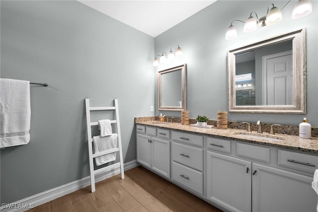 bathroom featuring vanity and hardwood / wood-style flooring