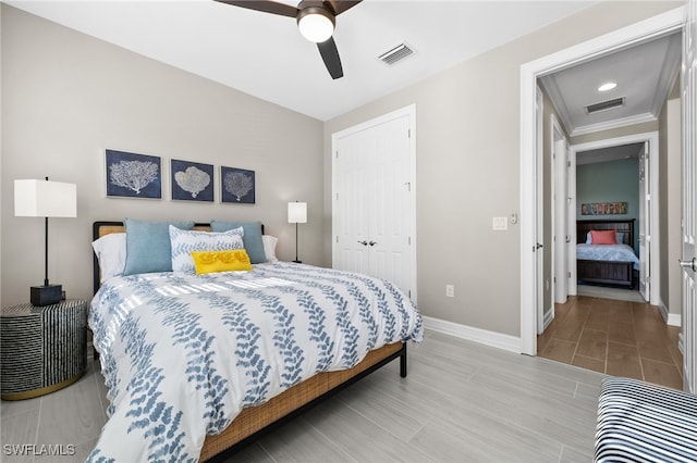 bedroom with a closet, ceiling fan, and ornamental molding