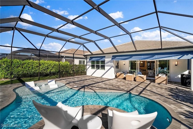 pool with glass enclosure, an outdoor hangout area, a water slide, and a patio