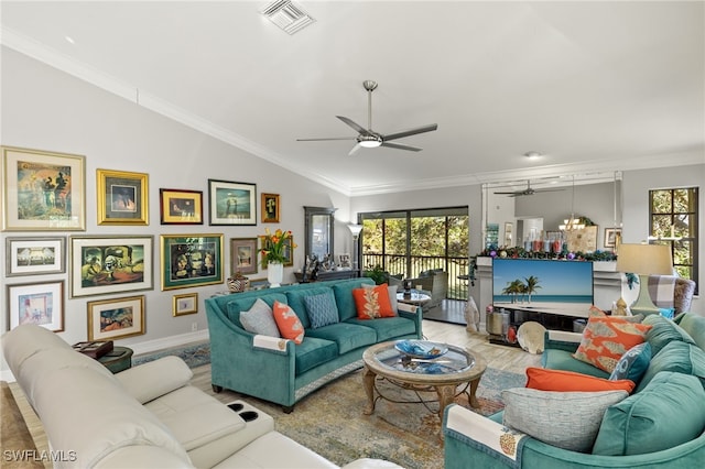 living room with lofted ceiling, hardwood / wood-style flooring, plenty of natural light, and crown molding