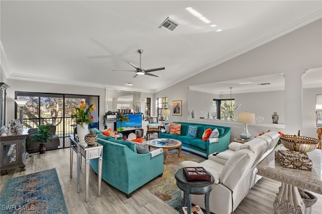 living room with ceiling fan, light hardwood / wood-style floors, ornamental molding, and vaulted ceiling